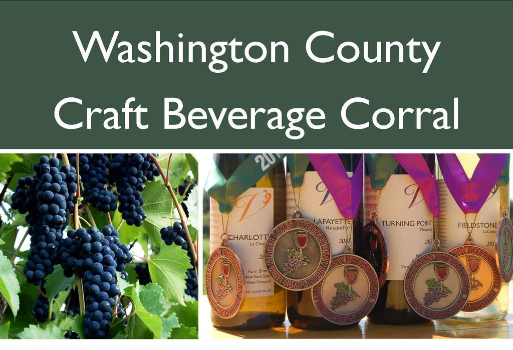 Victory View Vineyard at Craft Beverage Corral. Photo shows grapes and wine awards.