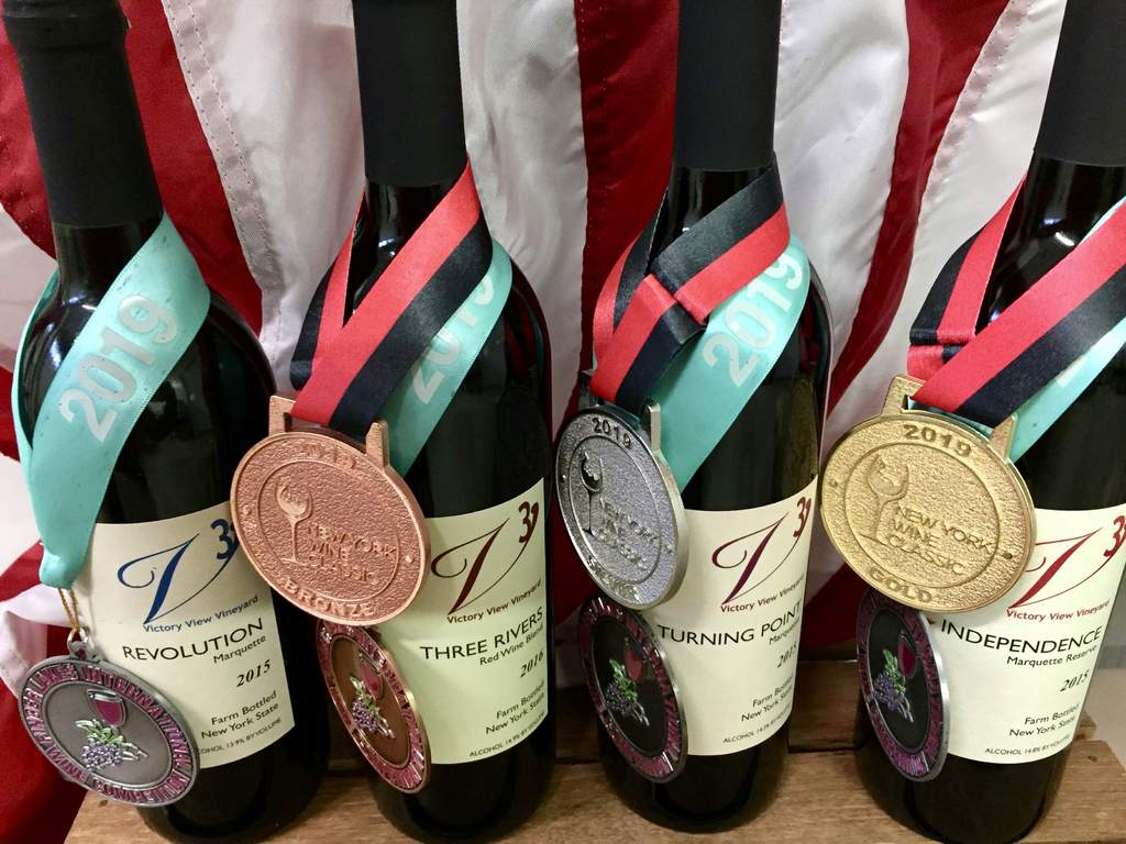 Open Nov 11th, wine bottles with award medals
