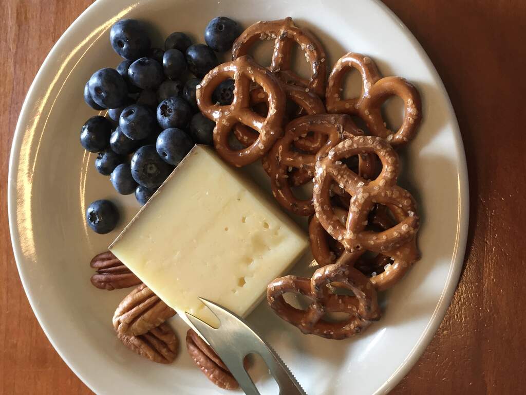 small cheese plate local cheese, blueberries, pretzels, nuts