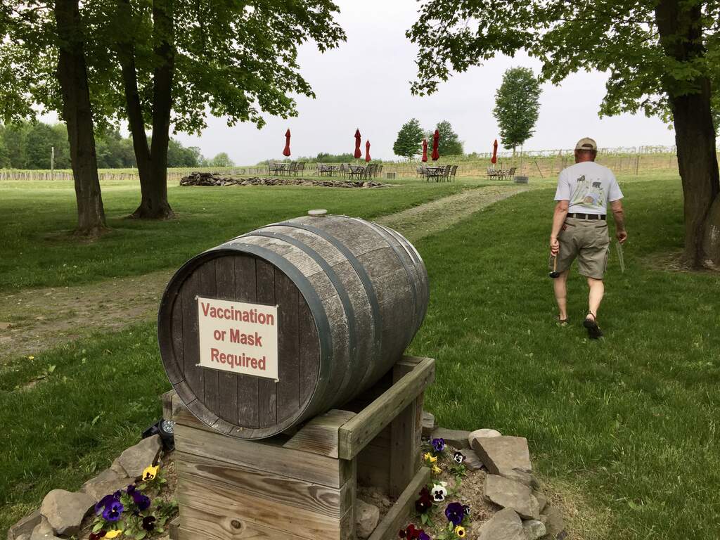 New parking lot barrel sign is up - Vaccination or Mask Required